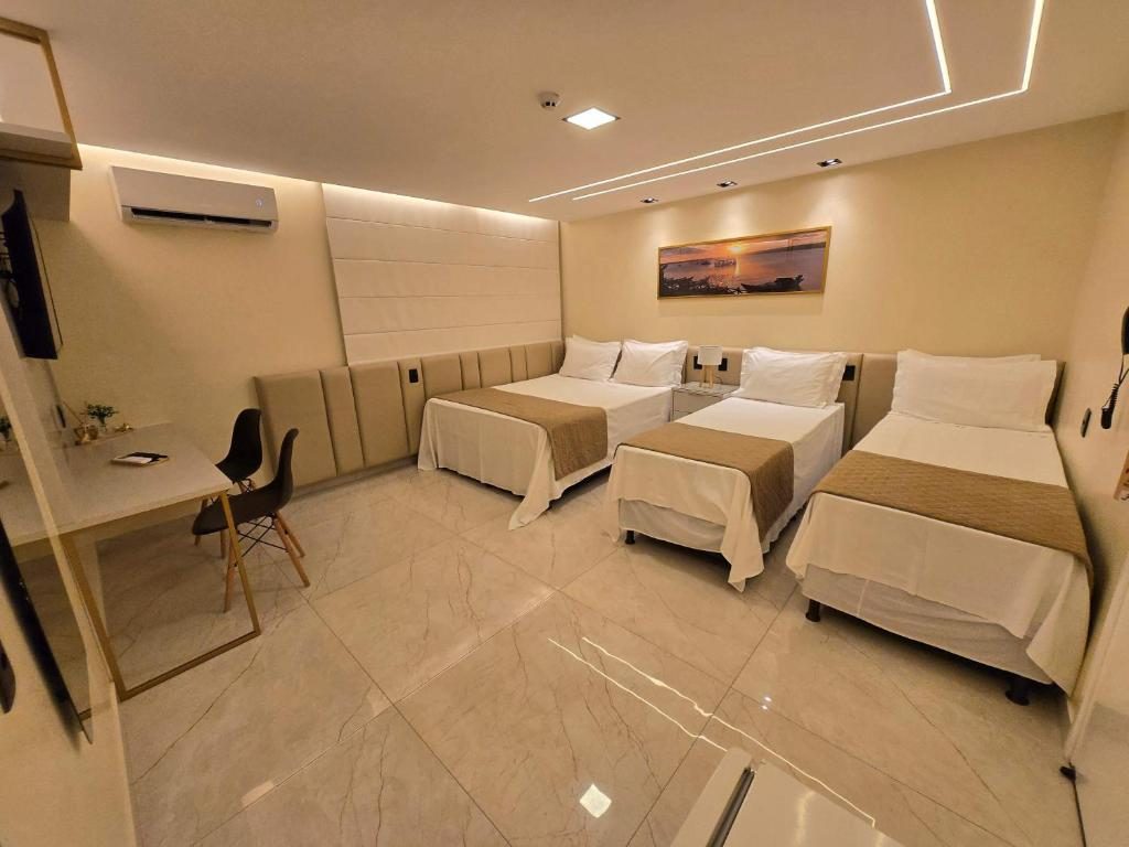 Quarto quádruplo com três camas
